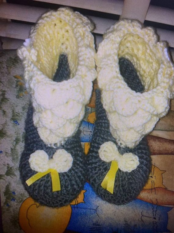 Cuffed Slipper Boots: Cozy slipper boots in charcoal with a ruffled cream cuff and yellow ribbon bows.