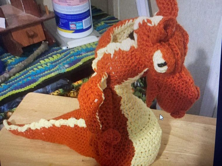 Ember Dragon: A long-necked dragon in rust and cream.